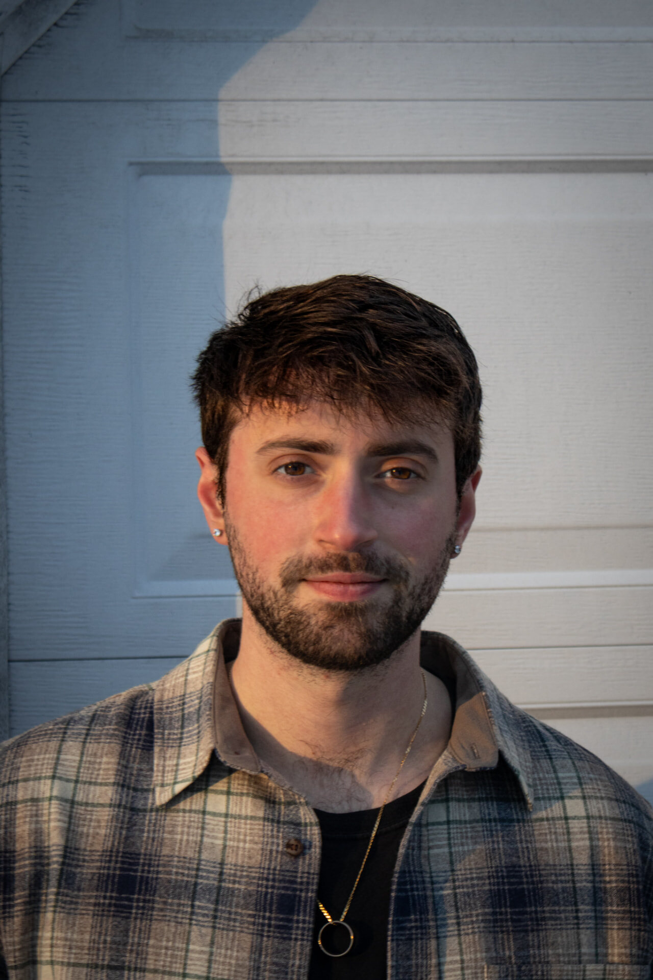 Louis Cervone, photographer and videographer, standing in warm afternoon light